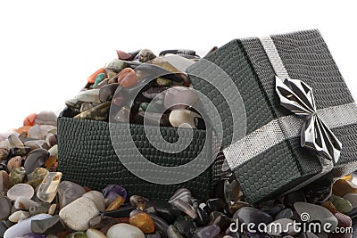 Gift box with semiprecious stones close-up Stock Photo