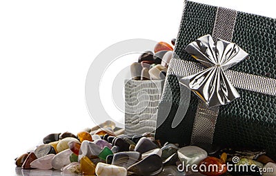 Gift box with semiprecious stones close-up Stock Photo