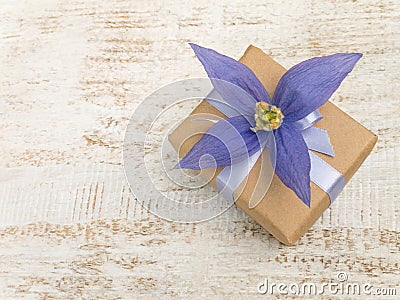 Gift box with violet four petals flower Stock Photo