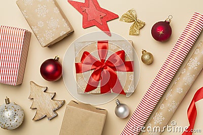 Gift boxes, paper's rools and decorations on color background, top view Stock Photo