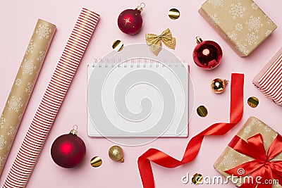 Gift boxes, paper's rools and decorations on color background, top view Stock Photo