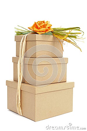 gift boxes tied with natural raffia of different colors and topped with a flower Stock Photo