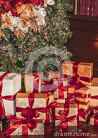 Gift boxes and traditional Christmas tree, wrapped presents and decor in colonial style as holiday home decoration Stock Photo