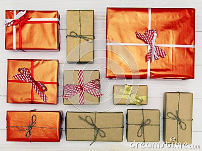 Gift boxes on white wooden background top view. Many gifts and surprises of gifts for Christmas, holiday. Stock Photo