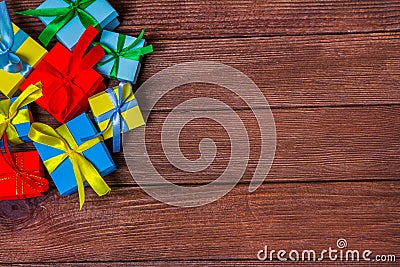 Gift boxes on wooden table. Collection of gift boxes on wooden board holidays concept. Stock Photo