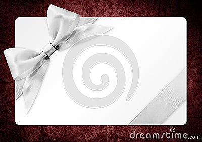 Gift card with silver ribbon bow Isolated on red backgrou Stock Photo