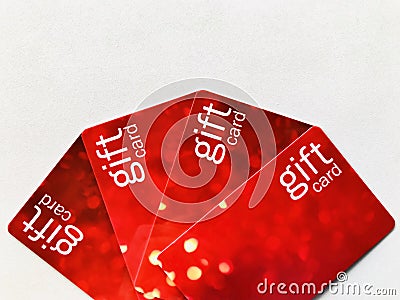 Gift cards. Four red gift cards Arranged in a fan shape. Stock Photo