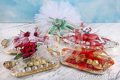 Gift of chocolate sweets with a red ribbon. Round chocolates in box. delicious round chocolates. Gift Box and ribbon Variety Stock Photo