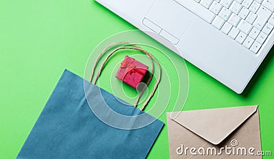 Gift, envelope, shopping bag and laptop Stock Photo