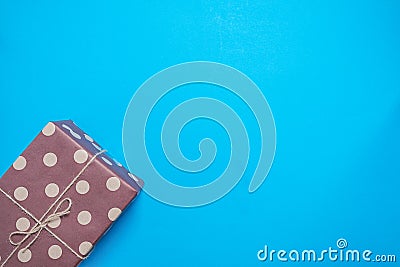 Gift in a festive packaging on a blue background Stock Photo