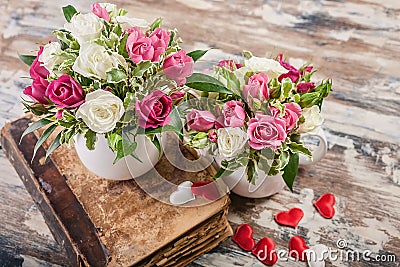 Gift Floristics. Handmade bouquet of roses with herbs in a large mug. Close up. Great gift for Mothers Day, March 8 or Valentines Stock Photo