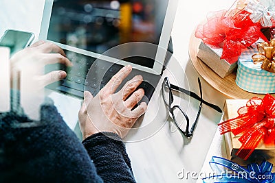 Gift giving Creative Hand with typing and hand with gift. Gift d Stock Photo