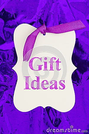 Gift ideas message gift tag over colorful purple glossy paper Stock Photo