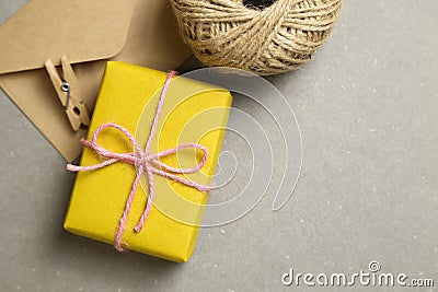 Gift box and kraft envelopes on gray background Stock Photo