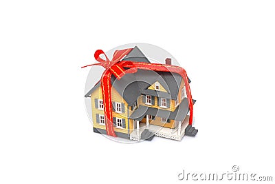 Gift miniature house with red ribbon isolated Stock Photo