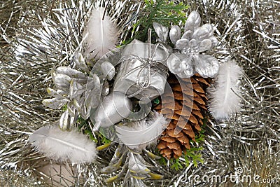 Gift and pine cones on a silvery tinsel Stock Photo