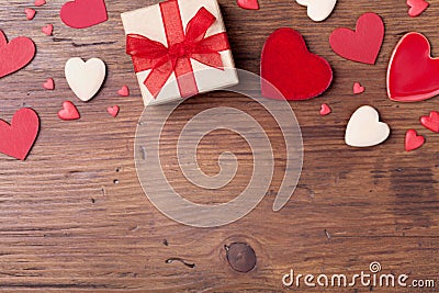 Gift or present box and mixed hearts for Valentines day background. Top view. Copy space for greeting text. Stock Photo