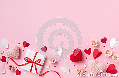 Gift or present box for Saint Valentine or Mother day decorated with pink red hearts and roses flowers top view Stock Photo