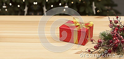 Gift in a red package. Christmas and New Year. On a wooden background Stock Photo