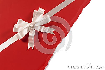 Gift ribbon bow with untidy torn red paper background, white copy space Stock Photo