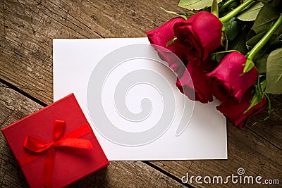 Gift roses and blank paper for valentine day Stock Photo