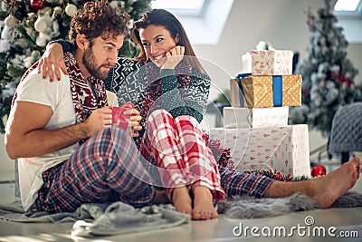 Gift surprise for Christmas.Woman surprise her boyfriend Stock Photo