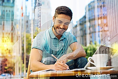 Gifted young author finishing his book and feeling excited Stock Photo