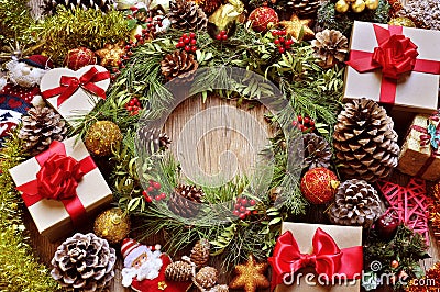 Gifts and christmas ornaments on a rustic wooden table Stock Photo