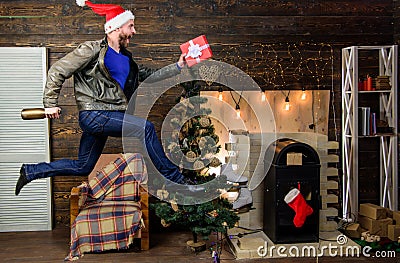 Gifts delivery. Man santa hat hurry to deliver gift on time. Christmas is coming. Spread happiness and joy. Bearded guy Stock Photo