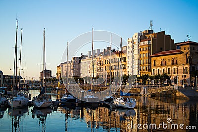 Gijon, Asturias, Spain; 09/26/2018: View of the dock of Gijon, Asturias, Spain, with reflections in the water, in Cimadevilla, the Editorial Stock Photo