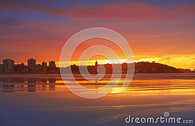 Gijon skyline sunset in San Lorenzo beach Asturias Stock Photo