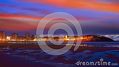 Gijon skyline sunset in San Lorenzo beach Asturias Stock Photo