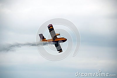 Fireplane flying during an army aircraft show. Editorial Stock Photo