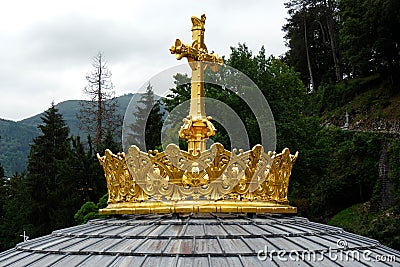 Gilded crown of the lourdes basilica Stock Photo
