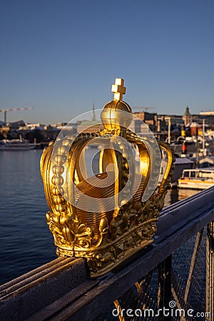 Gilded crown on Skeppsholmsbron with Strandvagen in the background. Stock Photo