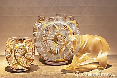 Gilded decorative bear figurine and glass flower vases - Home decor item Stock Photo