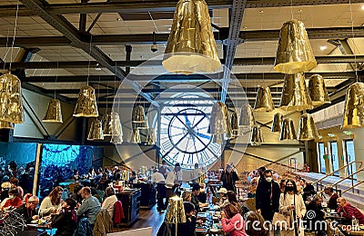 Gilded lamps hang over the Cafe Campana in the Musee d`Orsay, Paris, France Editorial Stock Photo