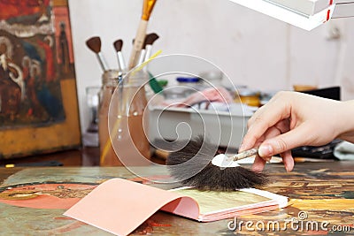 Gilding of ancient icon Stock Photo