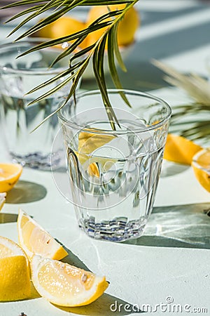 Gin tonic alcoholic cocktail drink with dry gin, bitter tonic, lemon juice. Wooden table background with copy space Stock Photo
