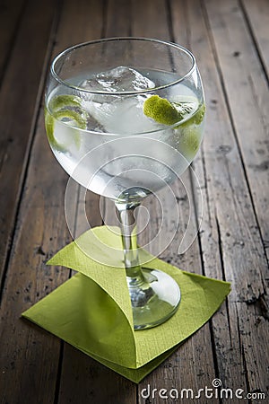 Gin and tonic garnished with lime Stock Photo