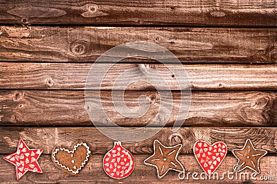 Ginger bread cookies and Christmas ornaments on wooden planks Stock Photo