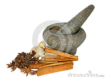 Ginger, cinnamon and star anise with stone pounder Stock Photo