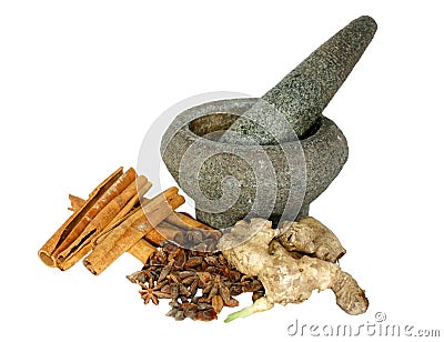 Ginger, cinnamon and star anise with stone pounder Stock Photo