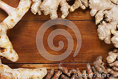Ginger,galangal and curcuma longa on wood Stock Photo
