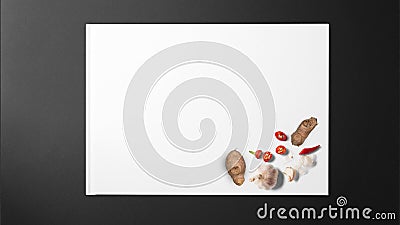 Ginger, garlic and red pepper on white paper on black background Stock Photo