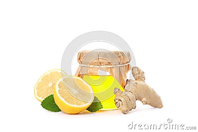 Ginger, lemons and glass jar with honey Stock Photo