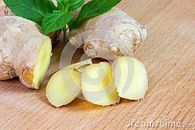 Ginger root with leaves of mint Stock Photo