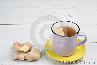 Ginger tea in a cup on wooden background Stock Photo