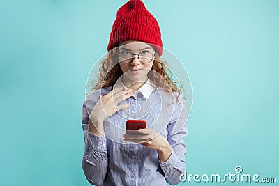 Ginger teenager wearing red cap and blue shirt looking at the camera Stock Photo