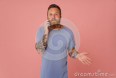 Ginger white man talking on cellphone and laughing Stock Photo